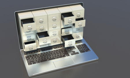 Filing archives cabinet on a laptop computer screen on an office desk. Digital records data storage and backup concept. 3d illustration